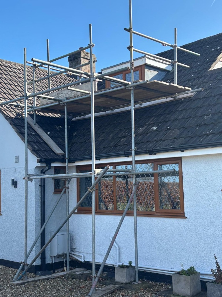 Scaffolding setup for bungalow dormer roof repair